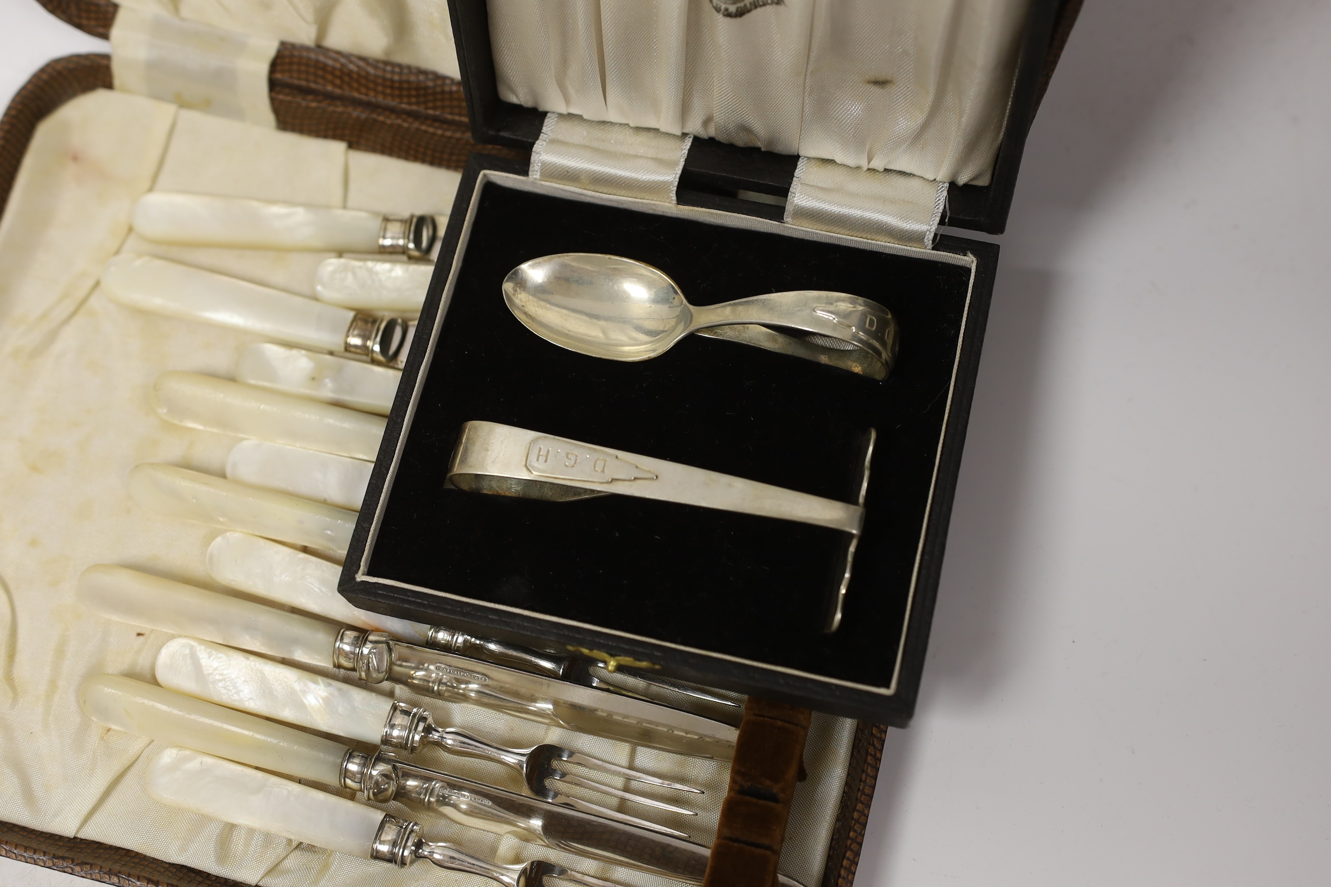 Four assorted cased cutlery sets including a set of twelve Norwegian gilt 925 and guilloche enamel coffee spoons.